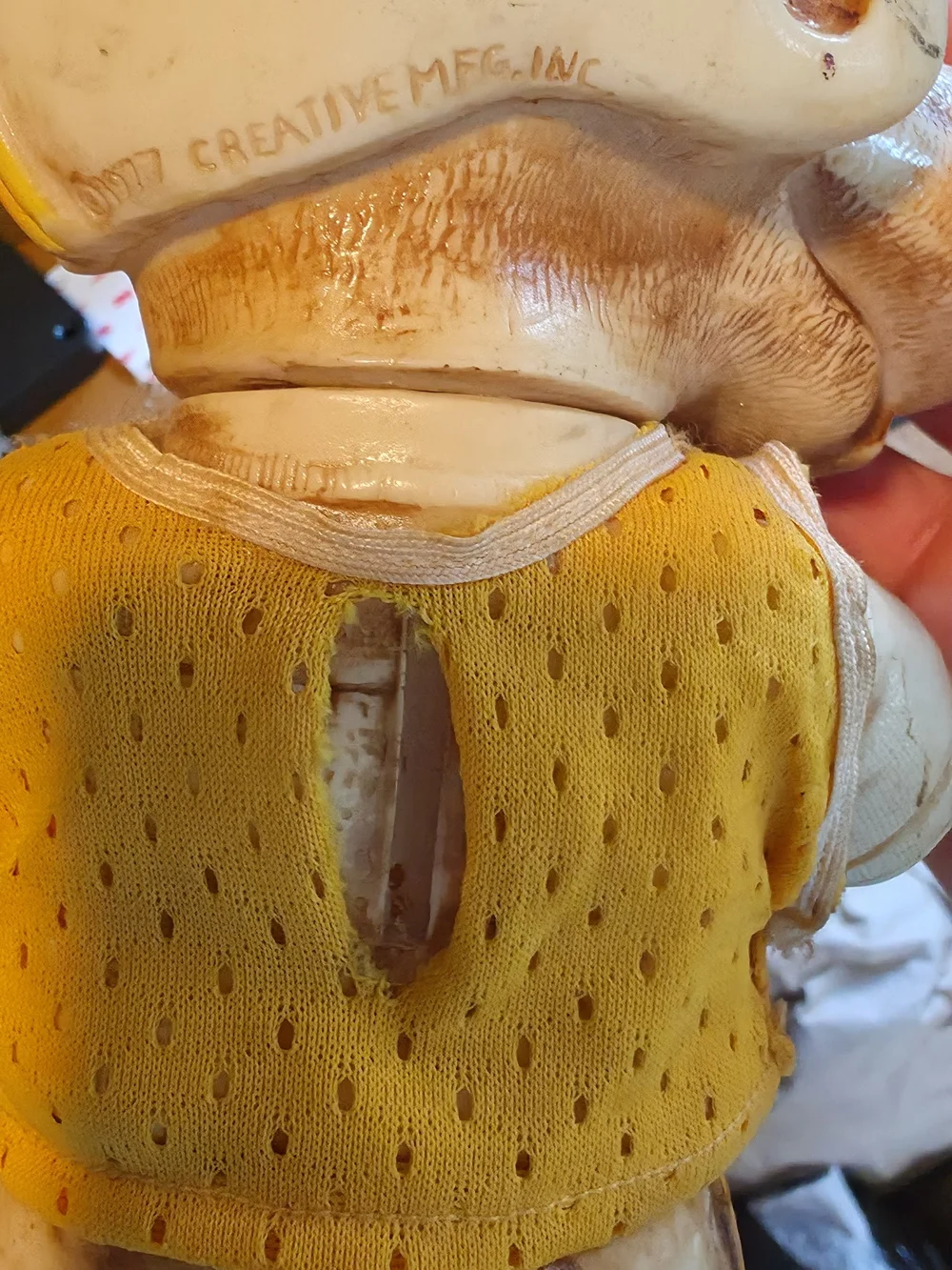Vintage Dog Figurine Wearing Helmet - Yellow Accent
